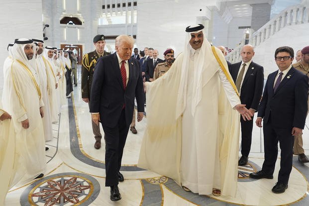 Qatar's Emir Sheikh Tamim bin Hamad Al Thani welcomes President Trump 