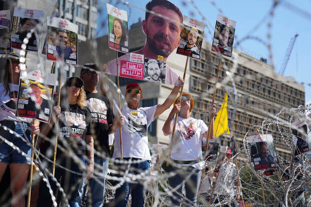 Families of hostages demand their release.
