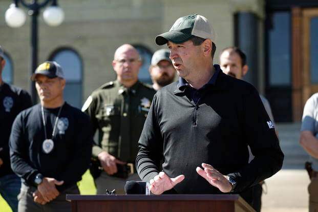Montana Attorney General Austin Knudsen speaks to the media