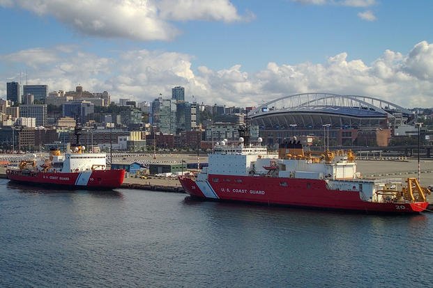 U.S. Coast Guard Cutter Polar Star (WAGB 10) (left) sits moored next to U.S. Coast Guard Cutter Healy (WAGB 20) at Coast Guard Base Seattle