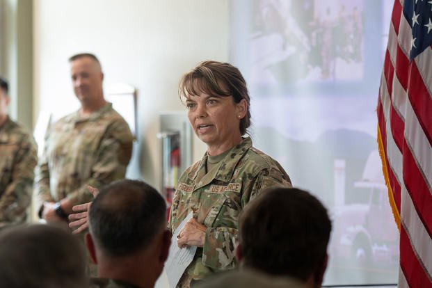 U.S. Air Force Col. Stephanie Figueroa, Commander for the 233rd Space Group, gives a speech