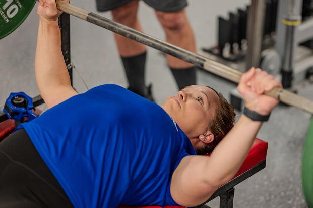 U.S. Air Force Chief Master Sgt. (ret.) Andrea Inmon performs the bench press during Warrior Games training in Colorado Springs, Colo.