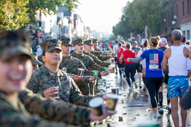 Runners and Marine Corps service members at the 2024 Marine Corps Marathon. (Photo by Marine Corps Marathon media team)