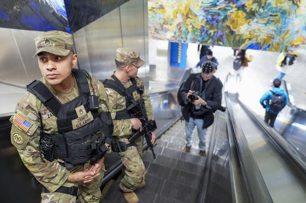 A couple of heavily armed New York National Guard soldiers patrol Grand Central terminal, Thursday, March 7, 2024, in New York. (AP Photo/Mary Altaffer) 