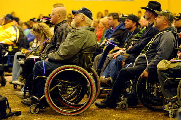 Veterans attend the opening ceremony inside The Silver Tree Hotel March 29 for the 23rd National Disabled American Veterans Winter Sports Clinic in Snowmass Village, Colo. (U.S. Air Force photo/Staff Sgt. Desiree N. Palacios)