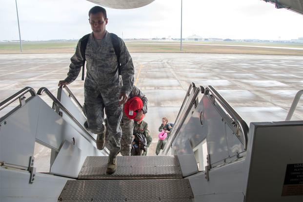 U.S. Air Force service members board a C-5M Super Galaxy from the Joint Base San Antonio-Lackland Passenger Terminal at old Kelly Air Force Base, Texas, Feb. 7, 2017. (Photo: U.S. Air Force)