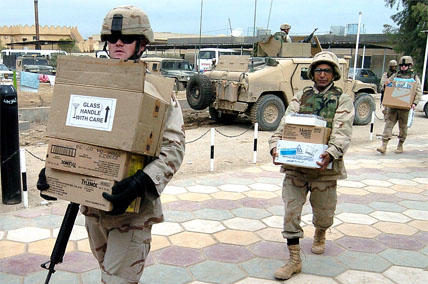 soldiers carrying boxes