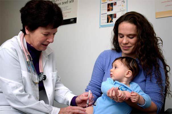Baby receives an immunization (Public Domain Photo)