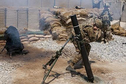 Army mortarmen fire a new Precision Guided Round from a 120mm motar in Afghanistan