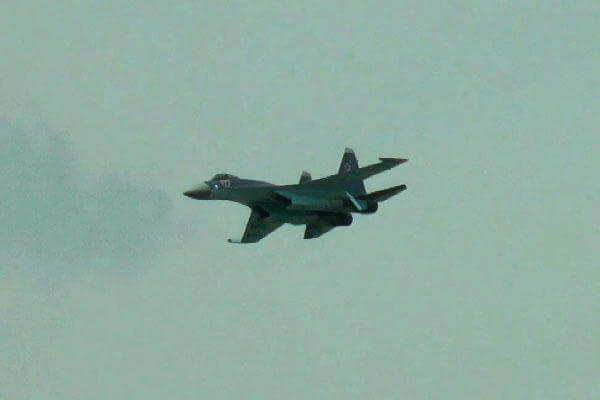 Russia's Sukhoi Su-35 fighter soars over the 2013 Paris Air Show. Military.com, Ho Lin
