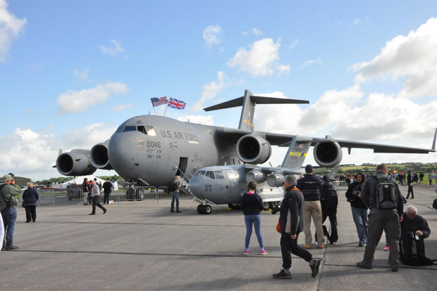 A C-17 Globemaster III from Joint Base Charleston, S.C., and the 315th Airlift Wing's mini C-17 were popular attractions at the Yeovilton Air Day 2016 at Royal Naval Air Station Yeovilton, England, on July 2, 2016. (U.S. Air Force photo/Maj. Wayne Capps)