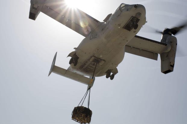 An MV-22B Osprey transports a 1,098 pound pallet of Meals, Ready to Eat during a helicopter support team exercise at Naval Station Rota, Spain, July 6, 2016. (Photo: Staff Sgt. Tia Nagle)