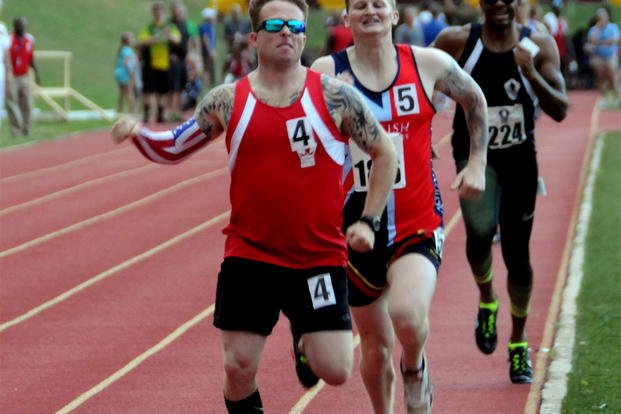Marine Corps Reserve Staff Sgt. Richard Delarosa-Buglewicz pushes ahead to finish first in his heat in the men's open 800-meter track event during the 2015 DoD Warrior Games at Marine Corps Base Quantic., June 23, 2015. (DoD photo/Shannon Collins)
