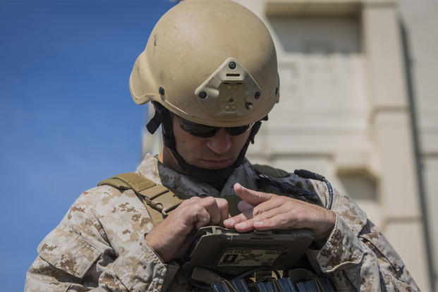 Capt. Richard Bussmann takes notes as he directs fires during a joint tactical air operation at Marine Corps Base Camp Lejeune, North Carolina, March 25, 2016. (Photo: Lance Cpl. Erick Galera)