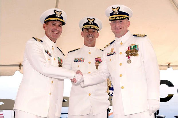 Capt. Edward St. Pierre (left) relieves Capt. William Lane as commanding officer of USCGC Morgenthau (WHEC 722) during a change of command ceremony at Coast Guard Base Honolulu, July 29, 2016. (Photo: Petty Officer 2nd Class Melissa McKenzie)