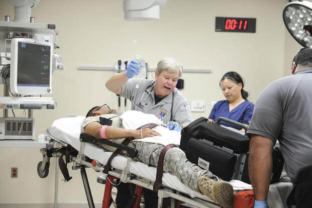 Paramedics and emergency department staff rush in a volunteer patient for a simulated trauma case at the Carl R. Darnall Army Medical Center at Fort Hood, Feb. 6, 2016. (U.S. Army photo/Fort Hood Public Affairs)
