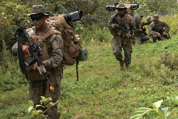 Marines patrol through the jungle March 19, 2013, at Naval Computer and Telecommunications Area Master Station Guam during a field training exercise as part of Exercise Guahan Shield. (Photo by Lance Cpl. Peter Sanders)