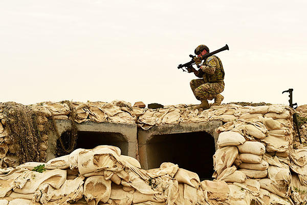 Staff Sgt. Andrew Croop, a 386th Air Expeditionary Wing explosive ordnance disposal technician, picks up a simulated rocket launcher during a joint EOD training exercise in Southwest Asia. (U.S. Air Force/Staff Sgt. Jerilyn Quintanilla)