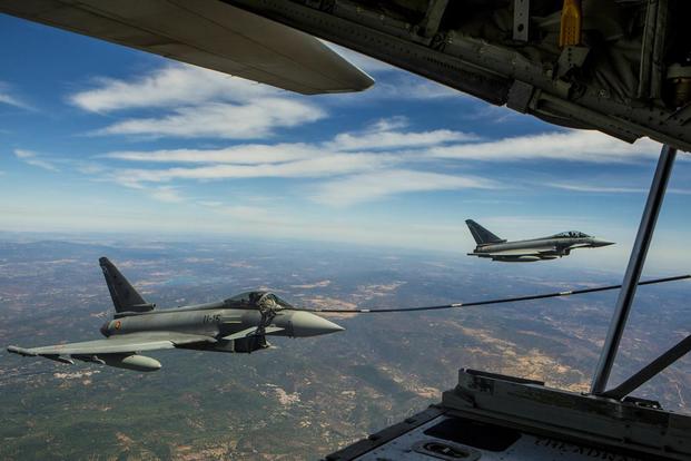A Eurofighter Typhoon with the Spanish Air Force receives fuel from a U.S. Marine KC-130J Hercules with Special-Purpose Marine Air-Ground Task Force Crisis Response-Africa, August 13, in Spain. (Photo: Staff Sgt. Vitaliy Rusavskiy)