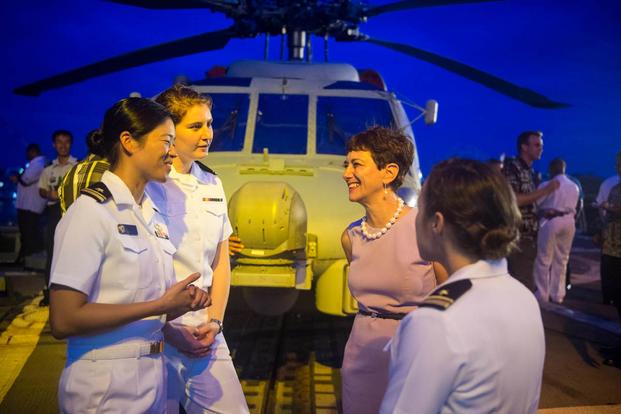 Ambassador Judith Cefkin, U.S. ambassador of Fiji, meets with junior officers on the flight deck of the guided-missile destroyer USS William P. Lawrence. (Photo: Mass Communication Specialist 3rd Class Emiline L. M. Senn)