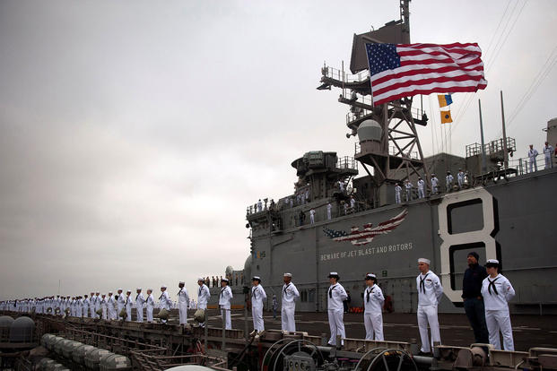 Sailors man the rails aboard the amphibious assault ship USS Makin Island (LHD 8) in 2012. Mass Communication Specialist 2nd Class Dominique Pineiro/Navy