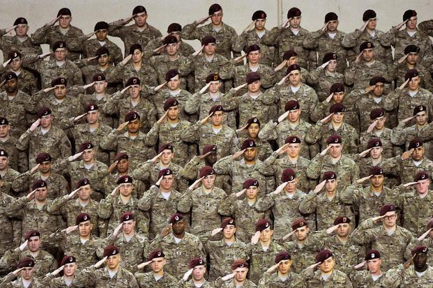 Airborne Soldiers from the 4th Brigade Combat Team (Airborne), 25th Infantry Division, salute during a Nov. 1, 2012, redeployment ceremony for the 4-25th ABCT at the Sullivan Arena in Anchorage. (U.S. Air Force photo by John Pennell)