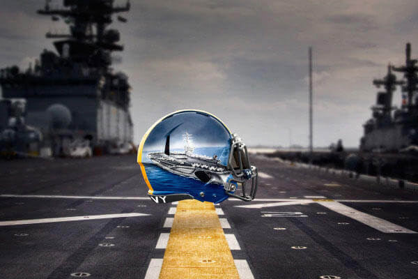 Quarterback: Aircraft Carrier – The QB of the Naval Fleet, the aircraft carrier is the ultimate decision maker; the “quick strike” weapon of the Naval fleet. (Image courtesy www.navysports.com)