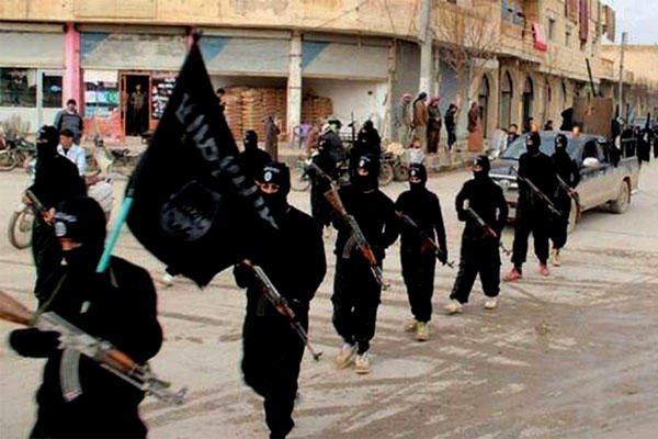 Islamic State terrorists march in Syria. (Courtesy Voice of America)