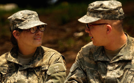 U.S. Army soldiers stare at each other's glasses during field training at Fort Jackson, S.C., on June 15, 2006.