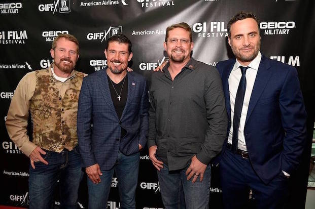 Mark Oz Geist, Kris Tantoâ Paronto, John Tig Tiegen, & Dominic Fumosa photographed on the red carpet at the G.I. Film Festival screening of â13 Hours: The Secret Soldiers of Benghaziâ on May 29, 2016.