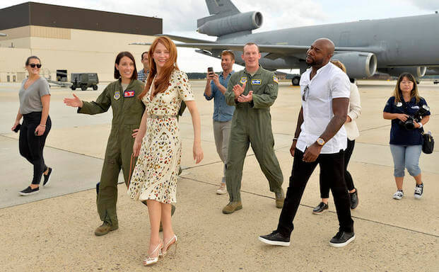 The Magnificent 7 director Antoine Fuqua (right) walks with movie actress Haley Bennett (2nd,left) as they are escorted by USAF Col. Darren R. Cole (center,background) and USAF Lt. Col. Jannell Macaulay (left) during a visit to a KC-10 tanker prior to a USO-sponsored film premiere at Joint Base McGuire-Dix-Lakehurst, New Jersey, September 18, 2016. The cast members and director toured the flightline, greeted service members and met with military families to extend their appreciation for their service. USO P