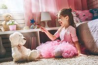 little girl playing in bedroom