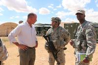 FILE - Kevin Fahey (left) and, Maj. Daniel Rodriguez and Col. Terrece Harris discuss new capabilities at the Expeditionary Base Camp at Fort Bliss, Texas. Fahey has been nominated for the post of assistant secretary of defense for acquisition. (ASA System of Systems Integration Directorate Public Affairs/ Vanessa Flores)