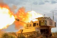 An M109 Paladin gun crew with B Battery, 4th Battalion, 1st Field Artillery Regiment, Division Artillery, at Fort Bliss, Texas, fires into the mountains of Oro Grande Range Complex, New Mexico, on Feb. 14, 2018.(U.S. Army photo by Spc. Gabrielle Weaver)