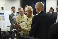 Commandant of the Marine Corps, Gen. Robert Neller, is briefed on the Advanced Capability Extended Range Mortar (ACERM) during an Office of Naval Research (ONR) awareness day. (U.S. Navy/John F. Williams)