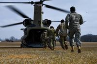 Soldiers with the 101st Combat Aviation Brigade, 101st Airborne Division (Air Assault), load equipment into a CH-47 Chinook helicopter in preparation to jump their tactical operations center (TOC) to a new location during Warfighter, a two-week command and control exercise Feb. 13, 2018, at Fort Campbell, Kentucky. (U.S. Army photo taken by Sgt. Marcus Floyd, 101st Combat Aviation Brigade)
