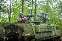 A U.S. Army Infantry soldier-in-training assigned to Alpha Company, 1st Battalion, 19th Infantry Regiment, 198th Infantry Brigade, engages the opposing force (OPFOR) May 2, 2017, with a M249 Squad Automatic Weapon (SAW) on a Stryker to provide support-by-fire during a squad training exercise. (U.S. Army photo/Patrick A. Albright)