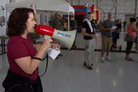 Kelli Richardson, the Marine Aircraft Group 16 family readiness officer, explains the sequence of events to participants, parents and Marines during the MAG-16 Junior Jarhead Day in aboard Marine Corps Air Station Miramar, Calif., June 7, 2014 (Lance Cpl. Christopher Johns/U.S Marine Corps)