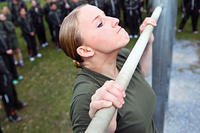 Lance Cpl. Katelyn M. Hunter conducts pullups during an initial assessment at Camp Foster, Dec. 12, 2012. (U.S. Marine Corps photo/Kasey Peacock)