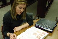 A military spouse studies at the Thomas S. Power Library at Offut Air Force Base. (U.S. Air Force/Staff Sgt. James M. Hodgman)