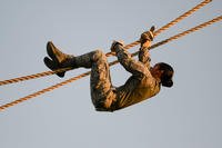 U.S. Air Force Staff Sgt. Jan Marie Csady, 97th Security Forces Squadron airman, descends a rope obstacle during the Air Education and Training Command’s Defender Challenge team selection July 23, 2018, at Joint Base San Antonio-Camp Bullis, Texas. Defender Challenge is a Security Forces competition that pits teams against each other in realistic weapons, dismounted operations and relay challenge events. (U.S. Air Force photo by Sean M. Worrell)