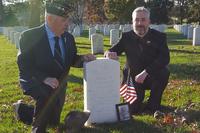 Dennis Anderson (left) and Garrett Anderson (right) at the gravestone of WWI soldier Pvt. Joseph Otto Turley, at Arlington National Cemetery, November 11, 2018. (Richard Sisk/Military.com)