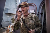 Vice Adm. Scott Stearney, commander of U.S. Naval Forces Central Command, U.S. 5th Fleet and Combined Maritime Forces, speaks Oct. 24, 2018 on the 1MC shipboard intercom to welcome the crew of the guided-missile destroyer USS Jason Dunham (DDG 109) to Manama, Bahrain.  (U.S. Navy/ Jonathan Clay)
