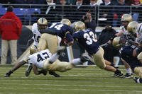 An Army linebacker tackles the Navy quarterback during the 108th annual Army Navy football game in Baltimore, Md. (U.S. Army photo by Mr. Kenneth Drylie)