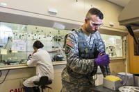 An Army Reserve Soldier with the 863rd Engineer Battalion, poses in a lab environment at the Argonne National Laboratory in Darien, Ill., as part of a photo shoot that promotes Citizen-Soldiers in the science, technology, engineering and math industries in 2014. (U.S. Army photo/Michel Sauret)