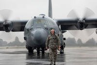 Chief Master Sgt. Eric Evers, 374th Aircraft Maintenance Squadron superintendent, walks on a ramp as he marshals a C-130H Hercules at Yokota Air Base, Japan, Oct. 16, 2017. (U.S. Air Force photo/Yasuo Osakabe)