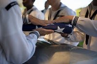 Sailors assigned to Navy Region Hawaii fold the American flag over the remains of U.S. Navy F1c Grant Clark COOK Jr. at the National Memorial Cemetery of the Pacific, Honolulu, Hawaii, May. 09, 2019.  (Jamarius Fortson/U.S. Army)