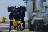 Petty Officer 3rd Class Dylan Poston, right, on flight deck of USS Stockdale in 2015. Poston is charged with the murder of Petty Officer 2nd Class Anderson Lopes Jr. after a fatal 2018 encounter in a California condominium. (U.S. Navy photo by Mass Communication Specialist 3rd Class Susan C. Damman)