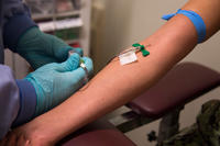 Hospital Corpsman draws blood at the phlebotomy lab on board NMCSD