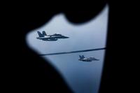 Two F/A-18D Hornets approach a KC-130J with Marine Aerial Refueler Transport Squadron 352 during a Special Purpose Marine Air-Ground Task Force-Crisis Response-Central Command aerial refueling exercise on Oct. 13, 2016. (U.S. Marine Corps photo by Cpl. Trever Statz)